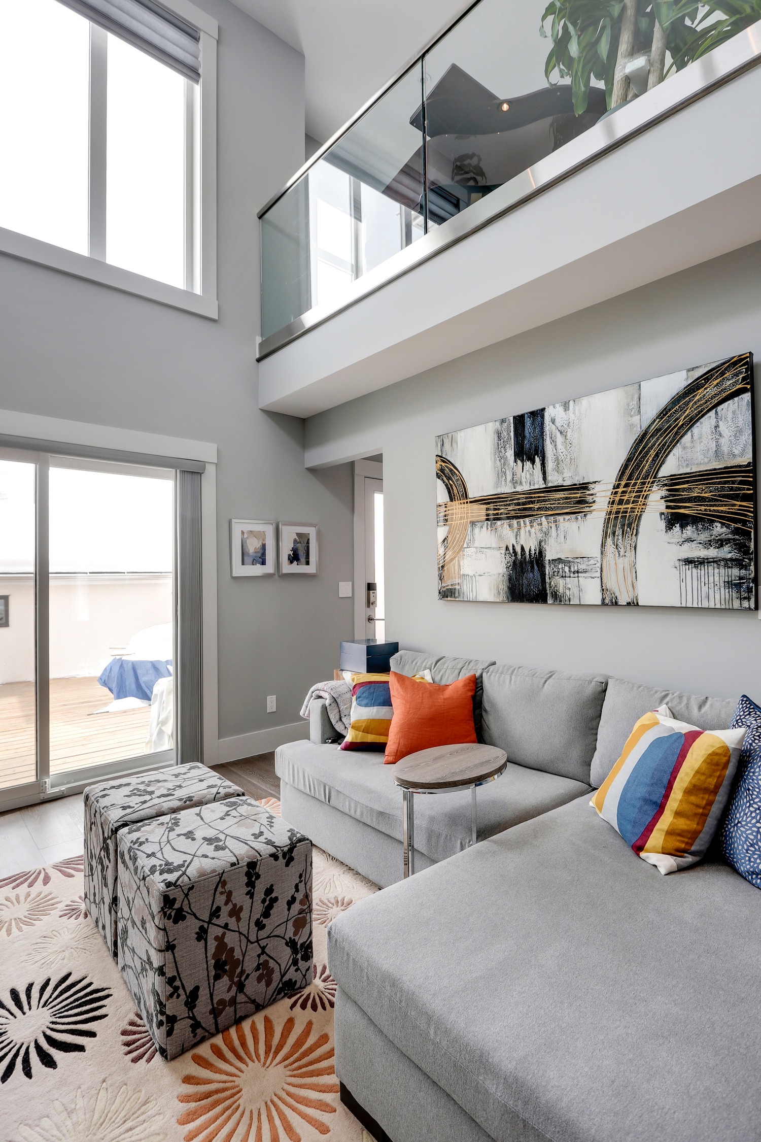 Vaulted living area with clerestory windows and glass railing overlook