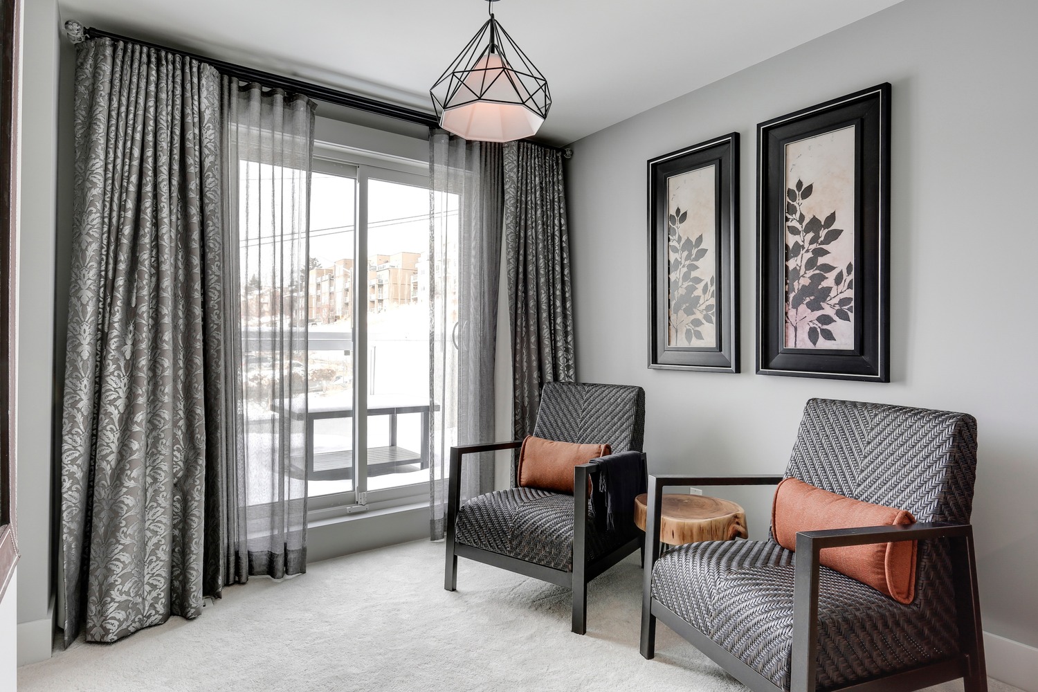 Private sitting area with pendant lighting and balcony views